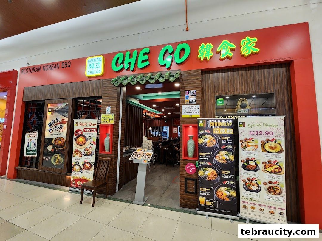 The exterior of Che Go Korean BBQ restaurant with promotional banners displaying food.