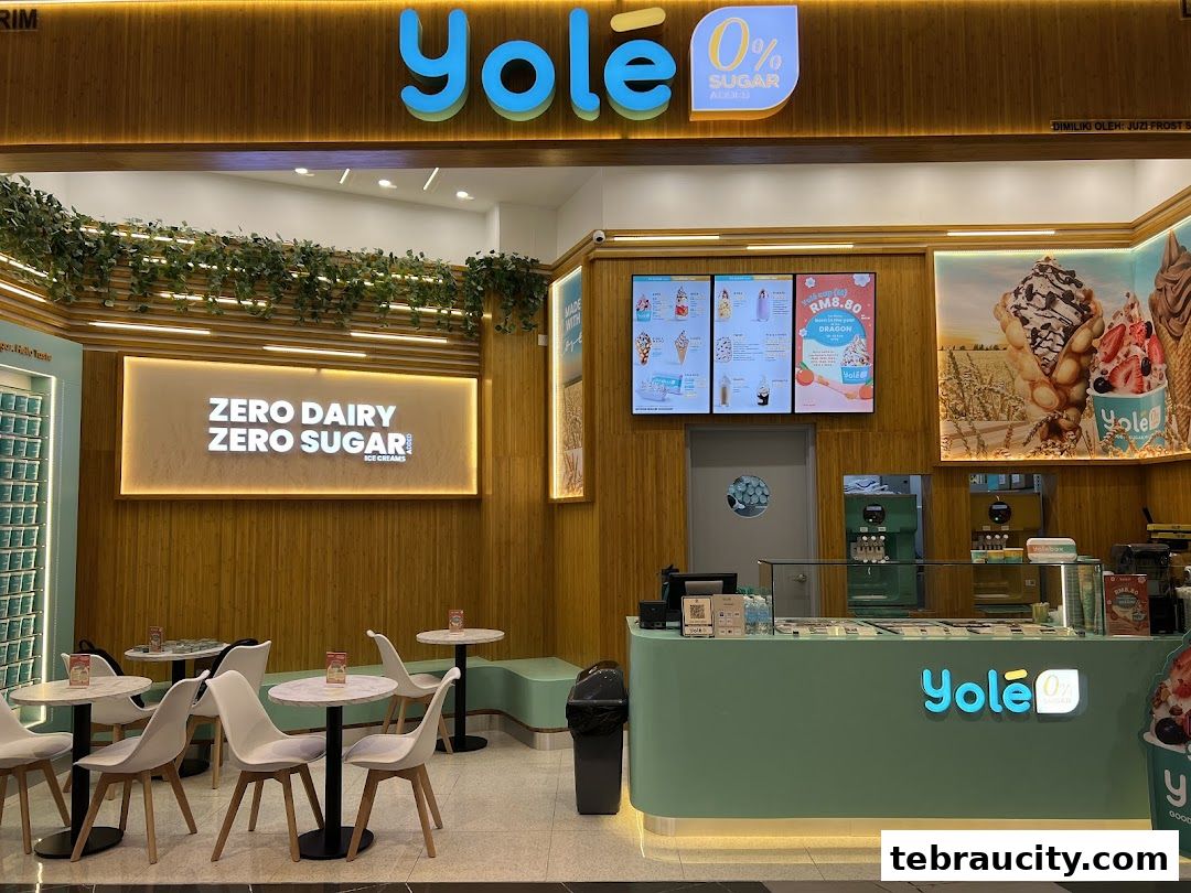The Yolé shop front features a modern design with bamboo-inspired walls and a bright green counter.