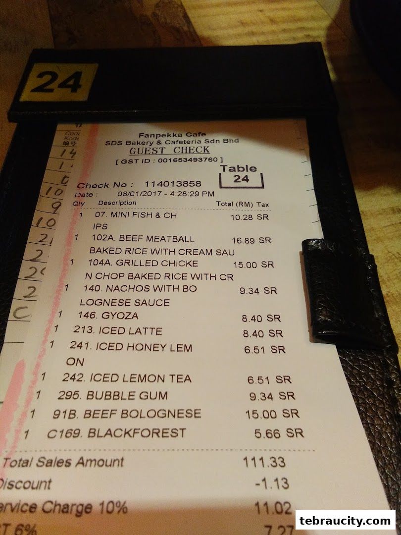 A close-up of a guest check from SDS Bakery & Cafeteria Sdn Bhd, listing food and drink items.