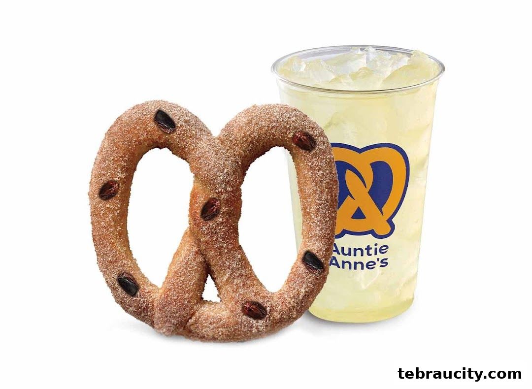 A cinnamon sugar pretzel with raisins and a lemonade drink from Auntie Anne's.