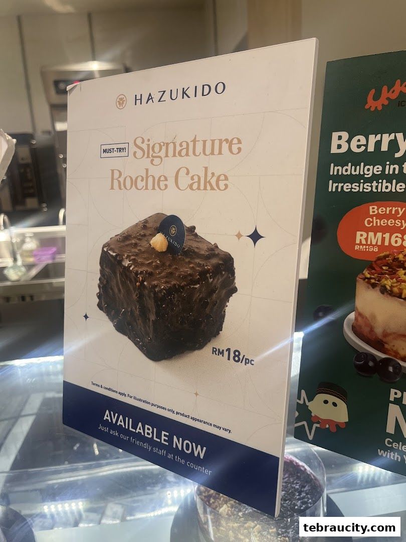 A sign advertising Hazukido's Signature Roche Cake and another cake.
