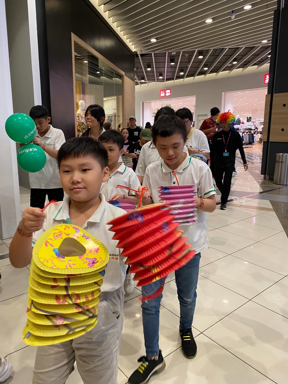 Joyful expressions of children at the AEON Mall Tebrau City Lantern Parade