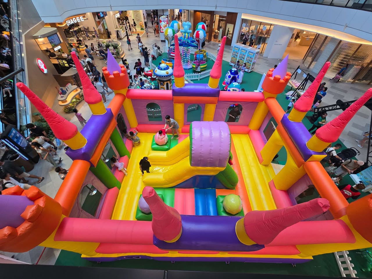 Families enjoying the community library and craft stations