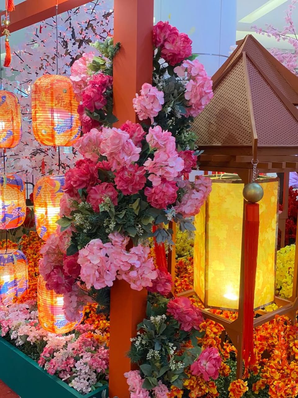 Shoppers enjoying the festive atmosphere at AEON MALL