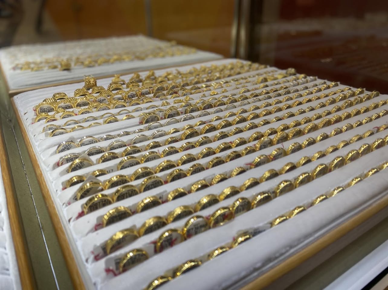 A stunning display of gold jewelry at the TOMEI showcase