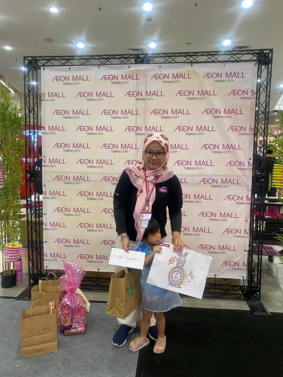 Children participating in the Mid-Autumn Festival Coloring Contest at AEON Mall Tebrau City
