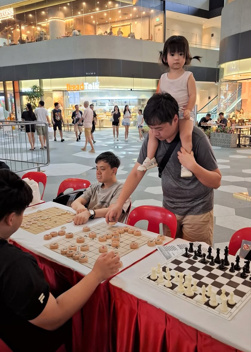 Participants engaged in a strategic game of chess.
