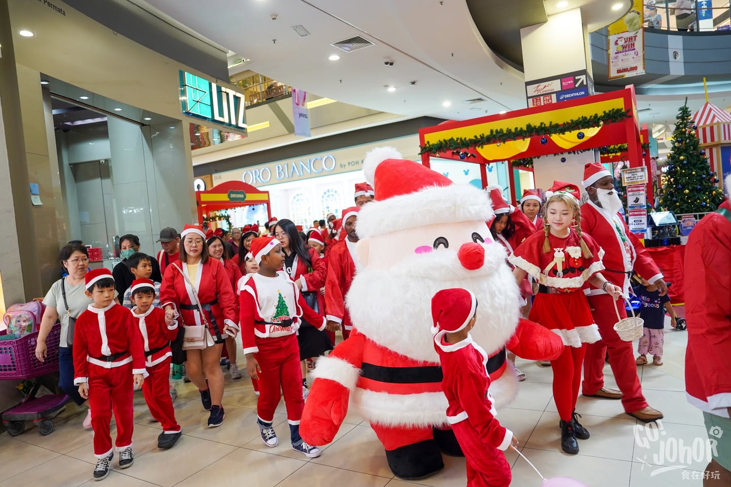 A group of Santas celebrating their successful, record-breaking gathering.