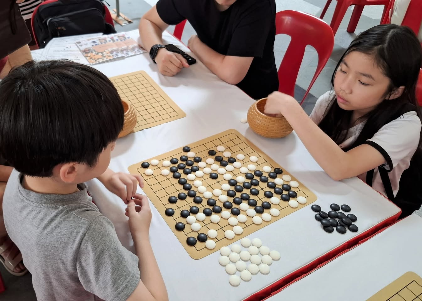 The vibrant and educational atmosphere of the Discover Chess zone.