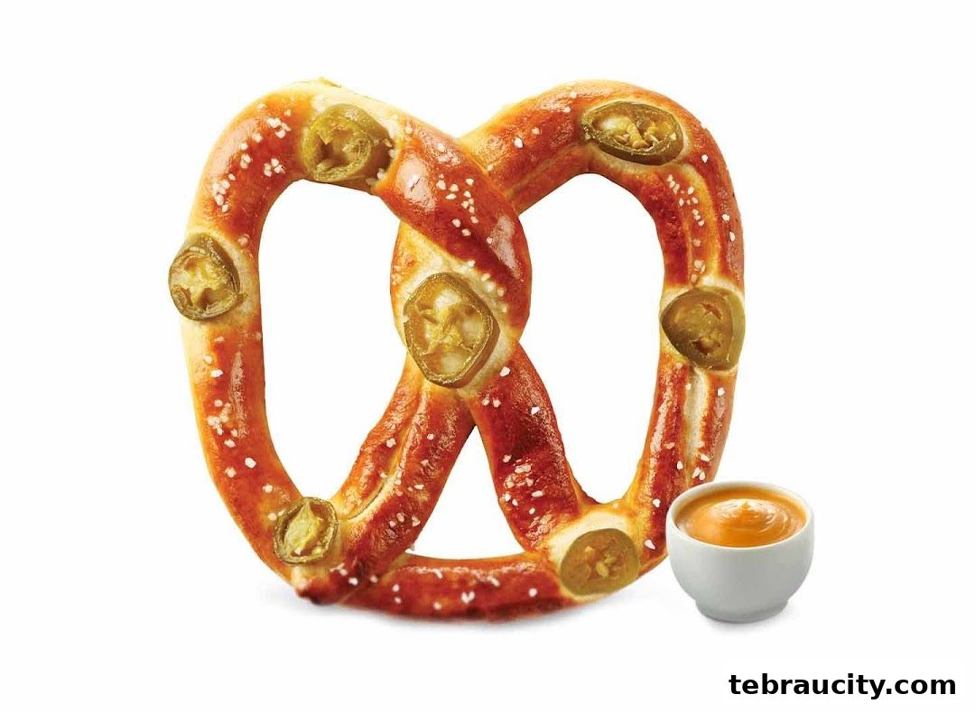 A jalapeno pretzel with cheese dip from Auntie Anne's.