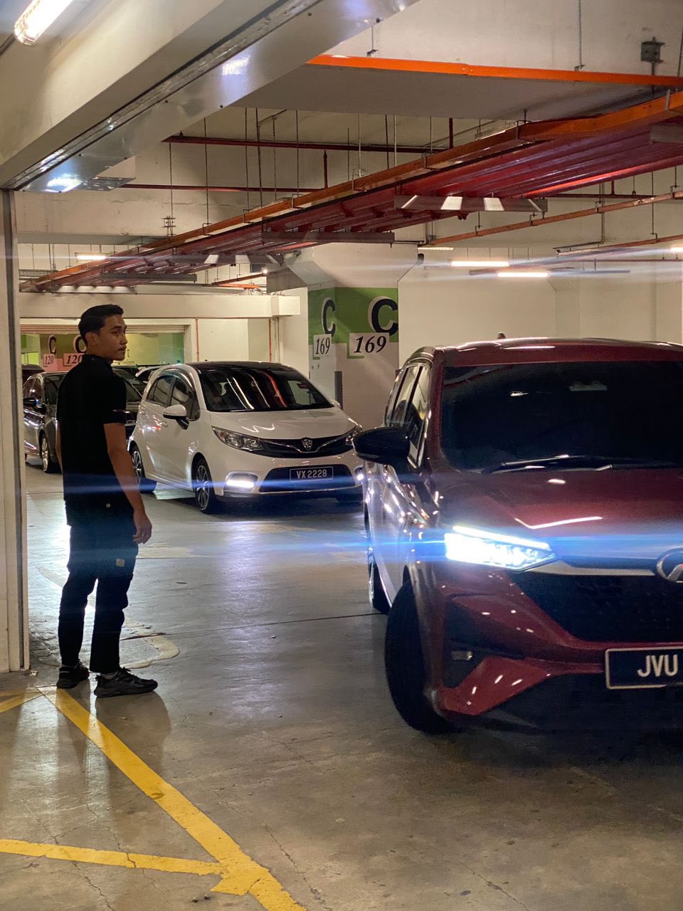 Mall staff assisting with traffic flow during peak hours