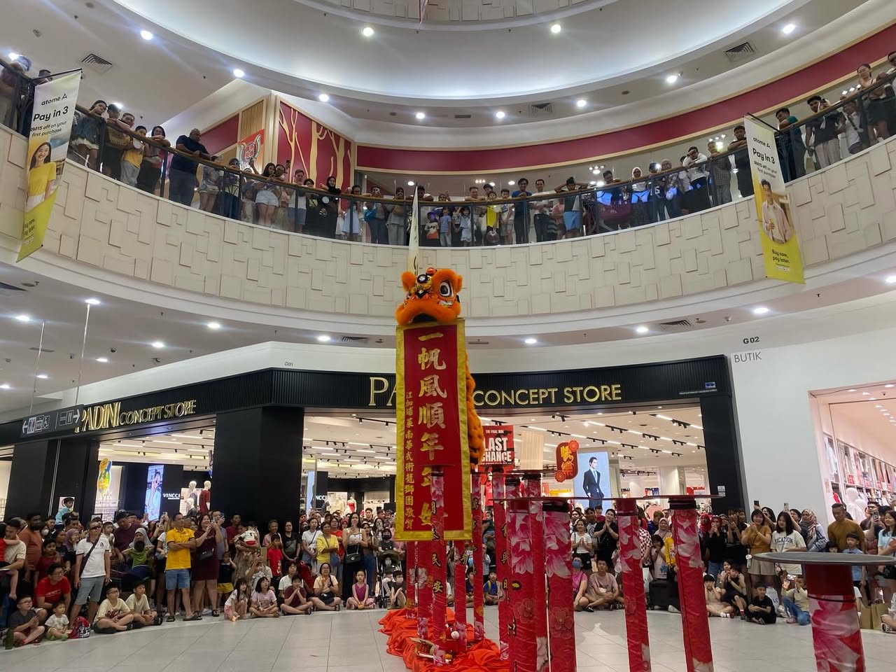 Performer executing a graceful maneuver during the high pole dance show