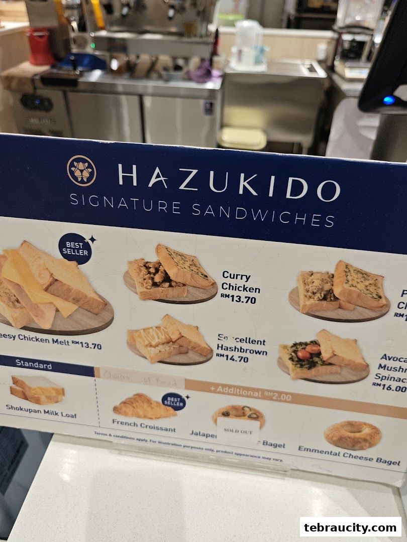 A menu board showcasing signature sandwiches and bread options from Hazukido.