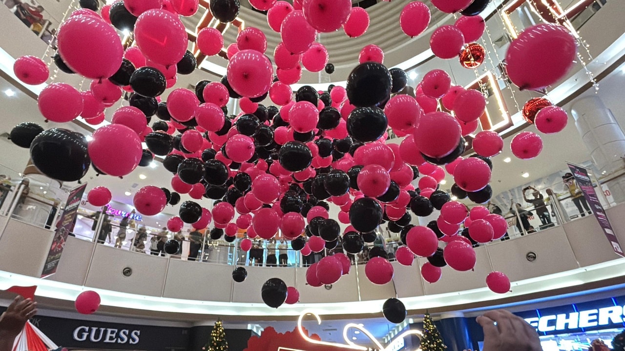 A cascade of colorful balloons filling the event space