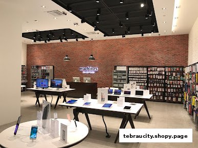 Interior view of a modern Apple Reseller Store with displays of iPhones, iPads, and accessories.