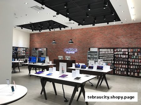Interior of an Apple Reseller Store showcasing various Apple products and accessories.