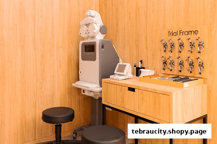 An optical examination room with advanced equipment and trial frames.