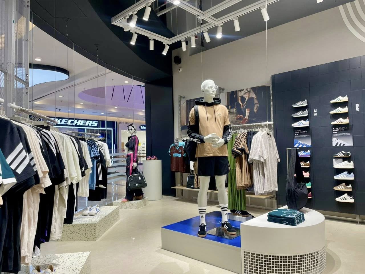 Lifestyle fashion collection inside the Adidas store with mannequins