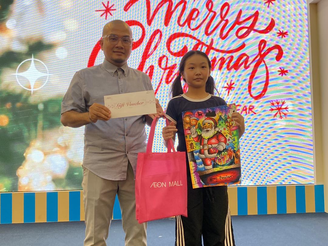 A judge carefully reviewing a colorful drawing from the contest