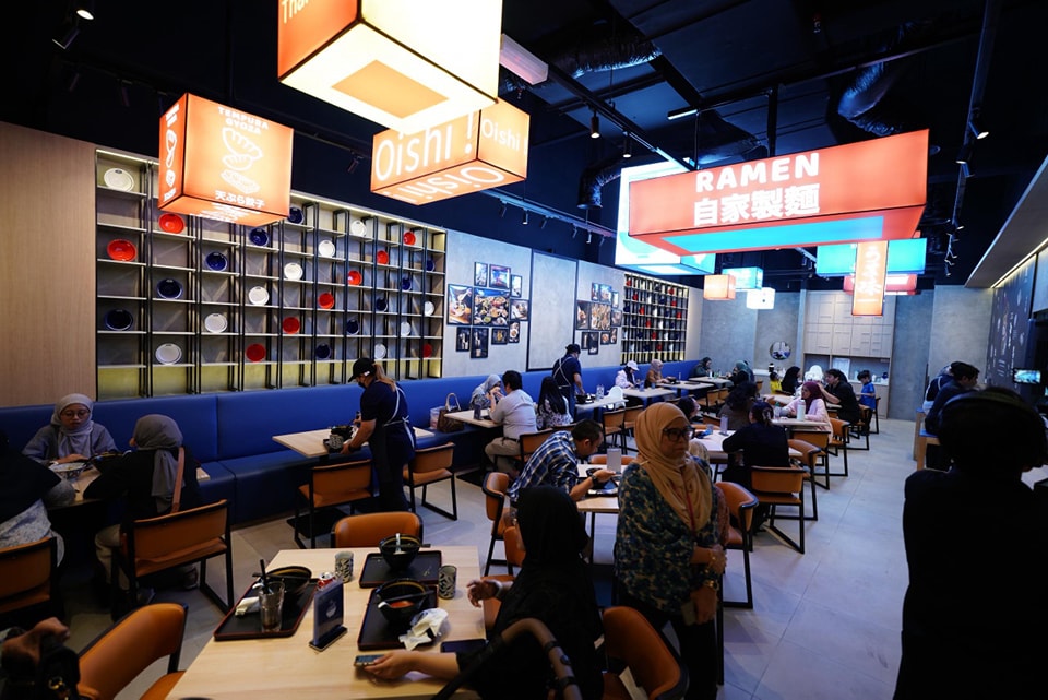 A steaming bowl of Maruki Ramen, showcasing rich broth, tender chashu, and fresh toppings.