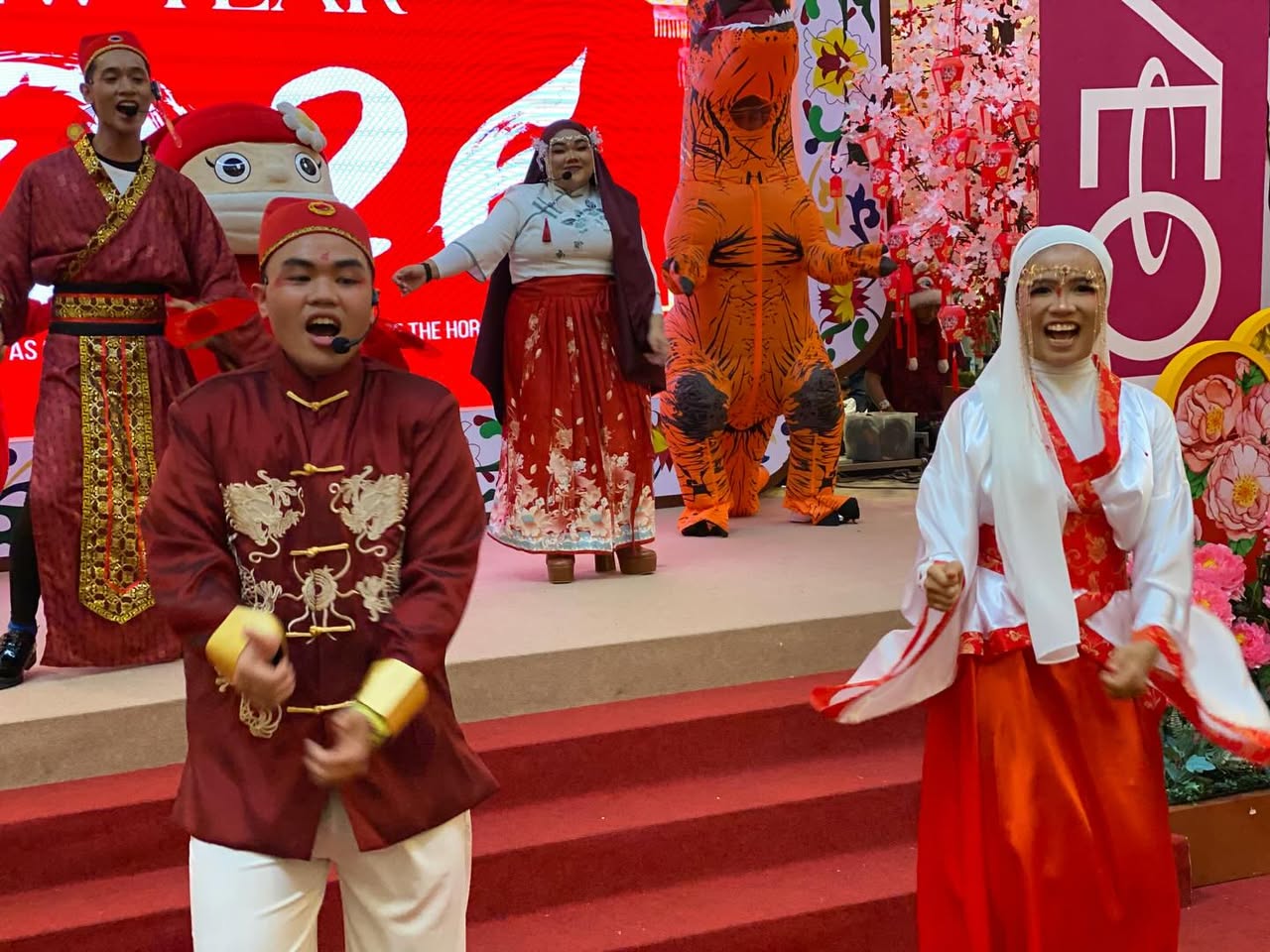 The lively procession moving through AEON MALL Tebrau City