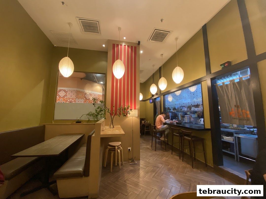 Interior view of Kibou-ken restaurant with seating and a counter.