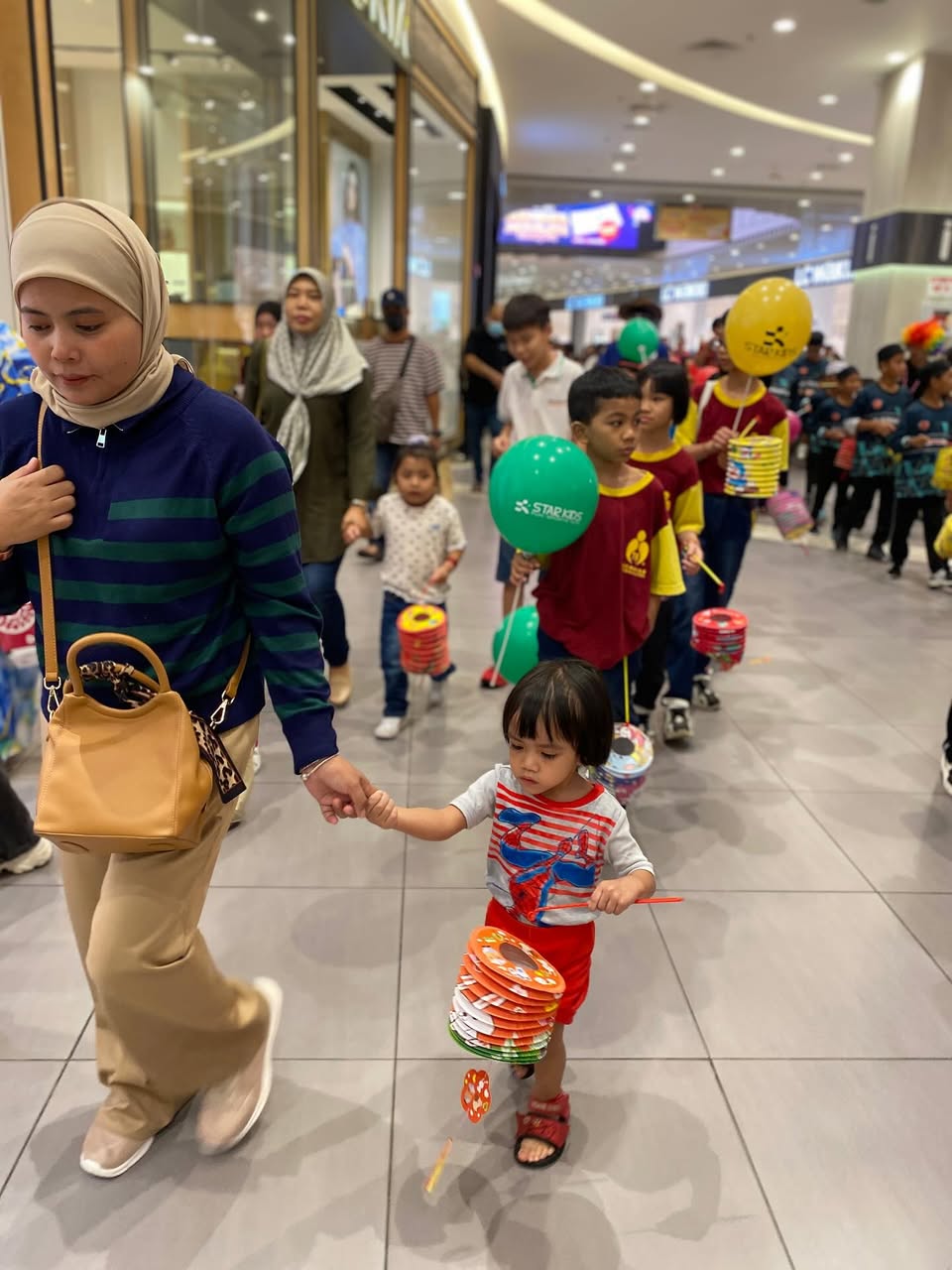A lively scene from the Mid-Autumn Festival community event