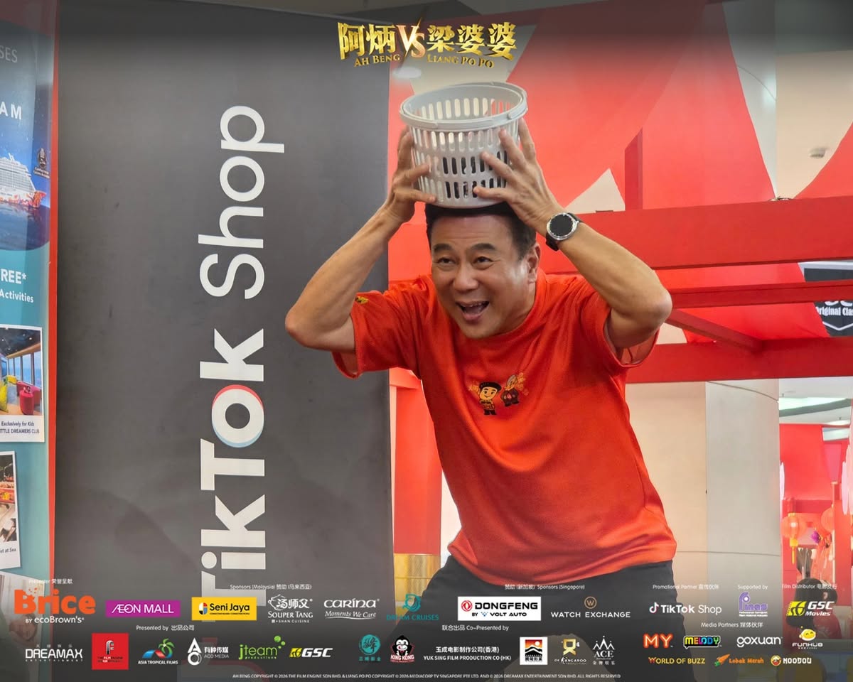 Excited supporters holding movie merchandise