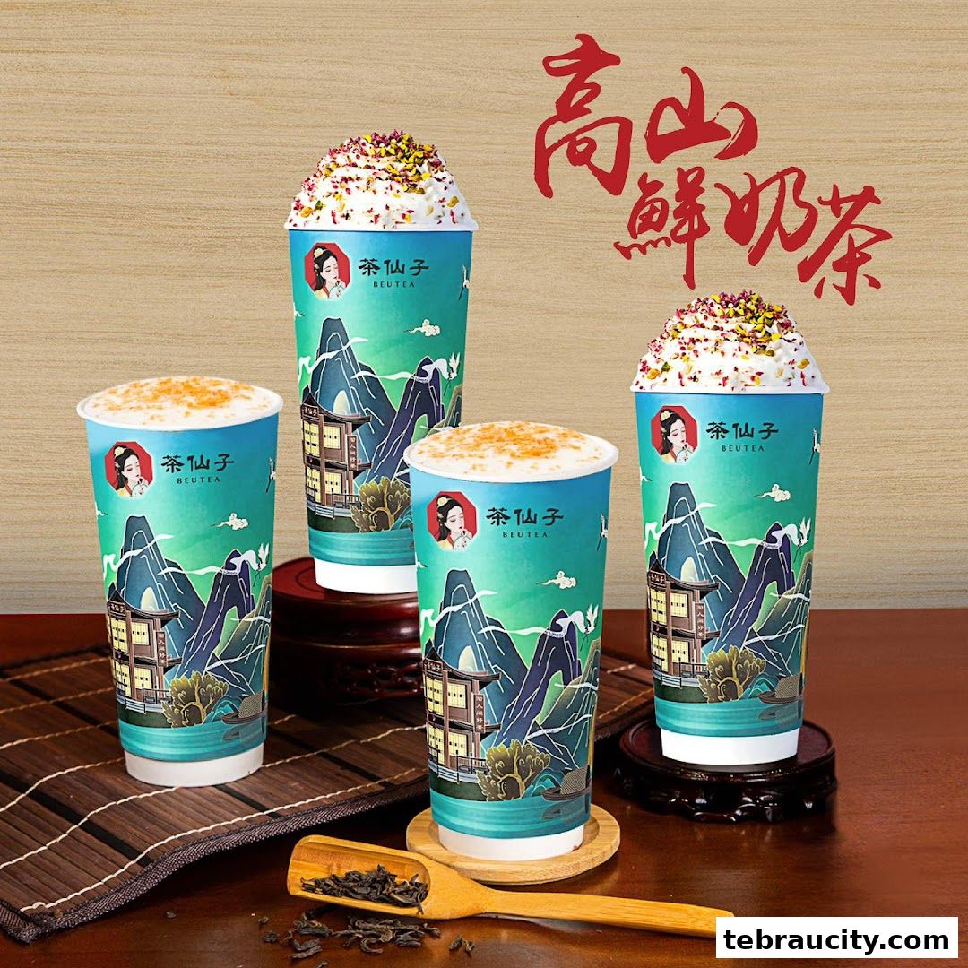 Four cups of Beutea drinks with a scenic mountain design and toppings.