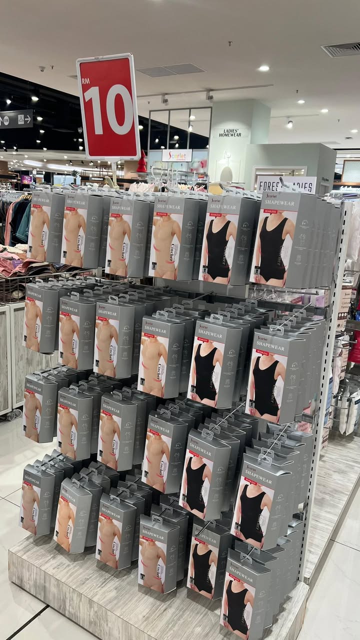 Clearance sale sign next to a collection of ladies' innerwear.