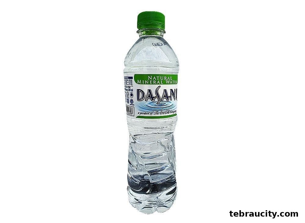 A bottle of Dasani Natural Mineral Water with a green cap against a white background.