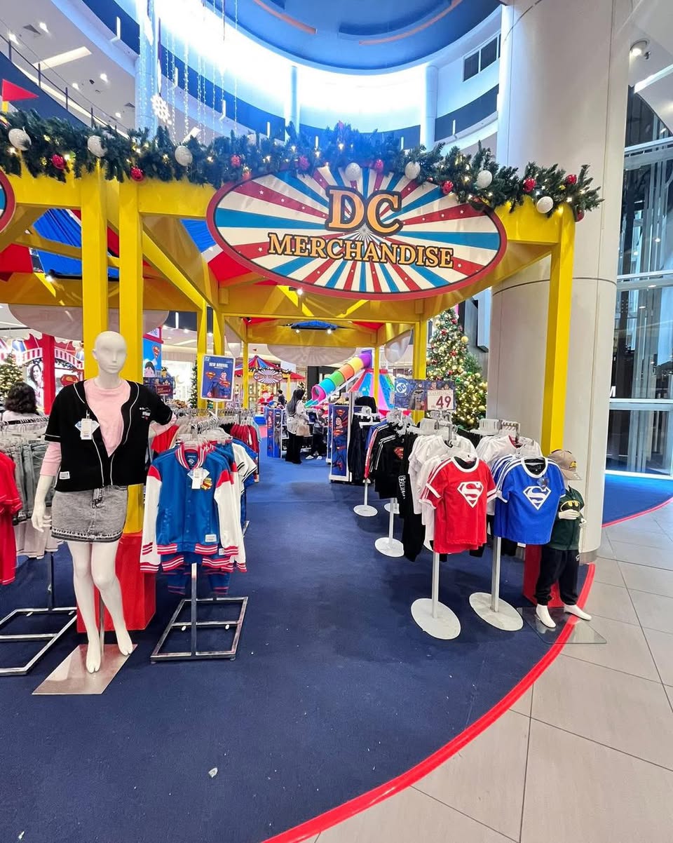 Close-up of detailed DC superhero action figures on display.