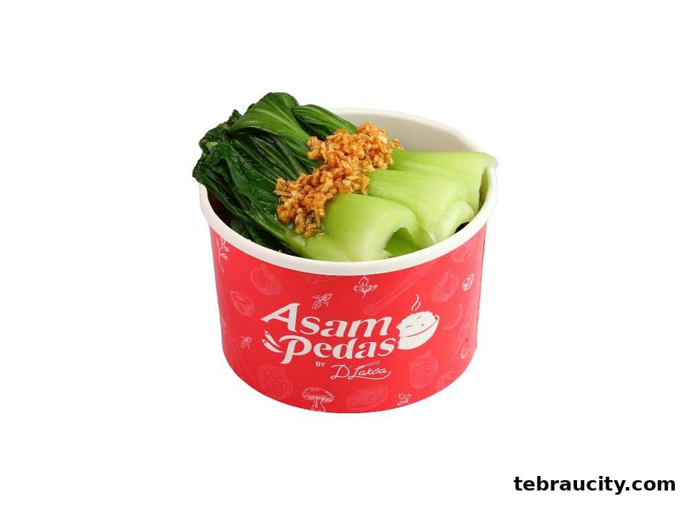 A bowl of steamed bok choy topped with crispy fried garlic, served in a red branded container.