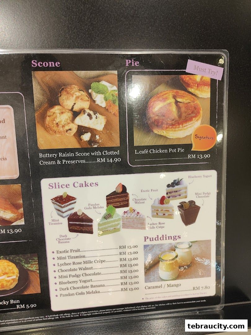 A menu display featuring scones, pies, slice cakes, and puddings with prices.