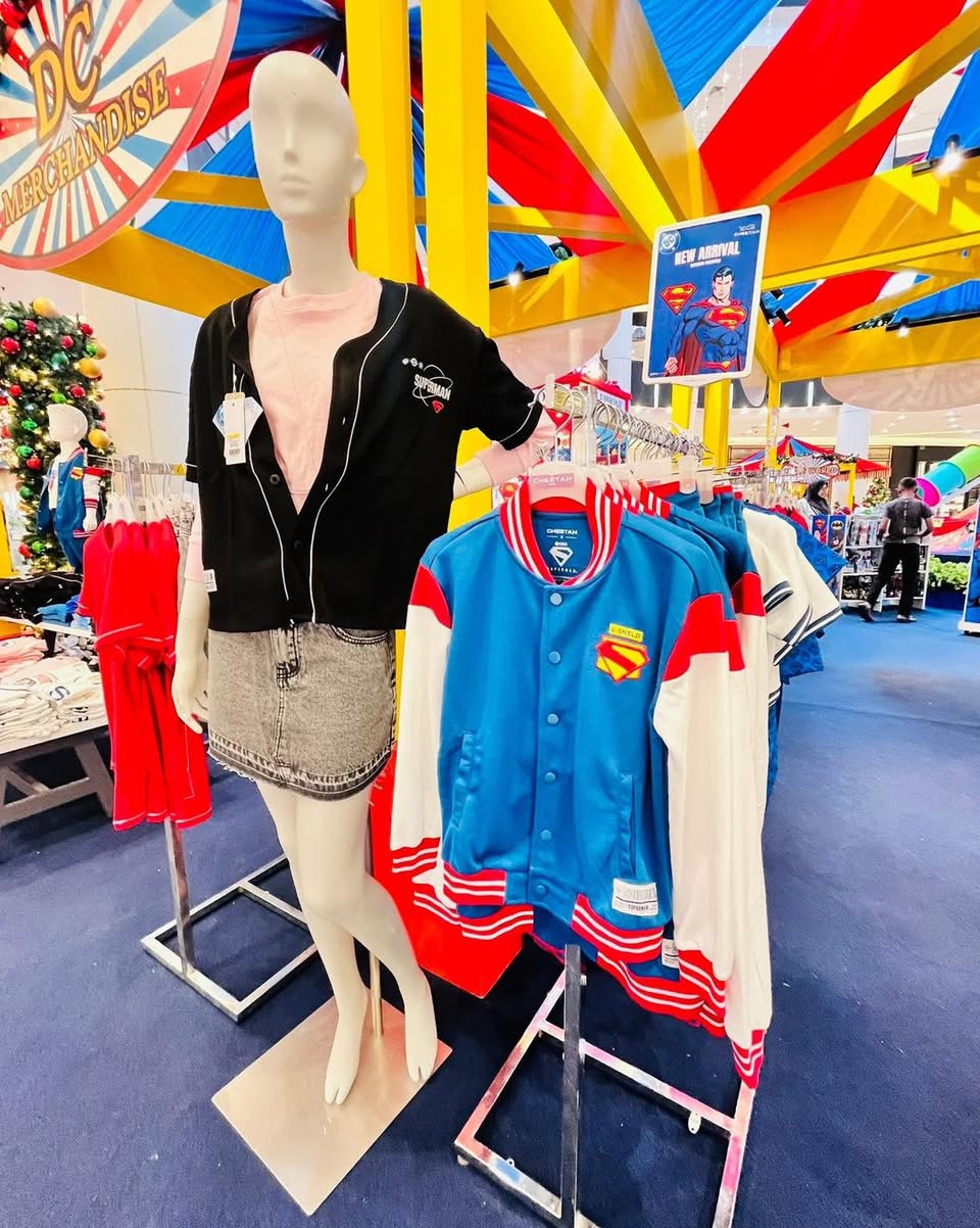 A vibrant display of DC Comics merchandise, including collectible figures and apparel.