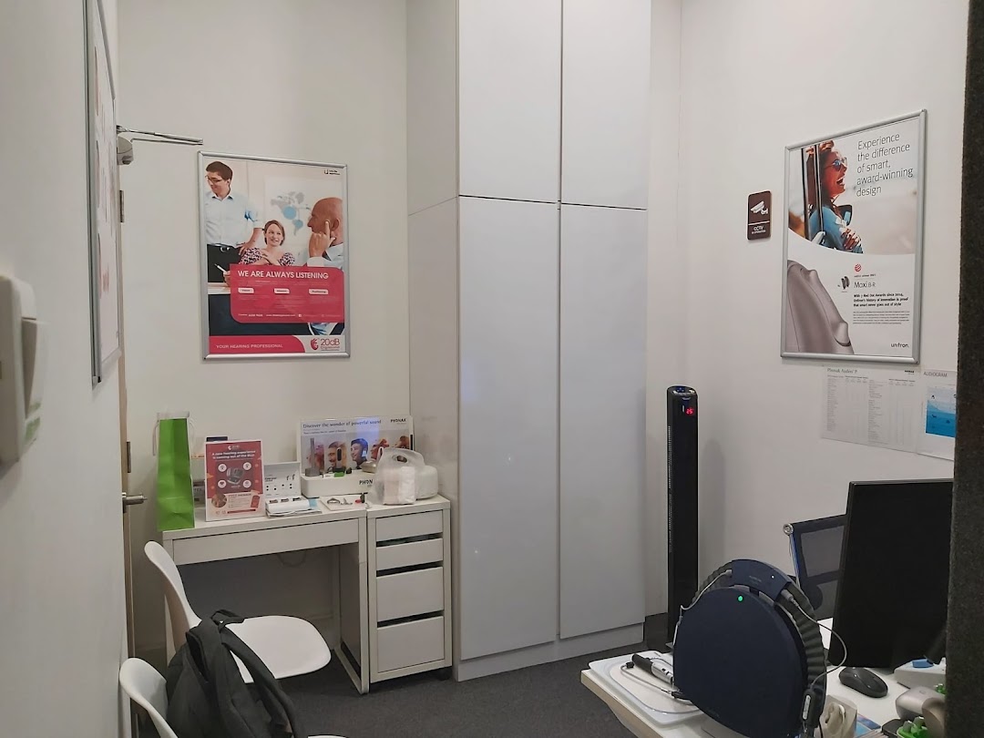 An interior view of a 20dB Digisound consultation room with posters and equipment.