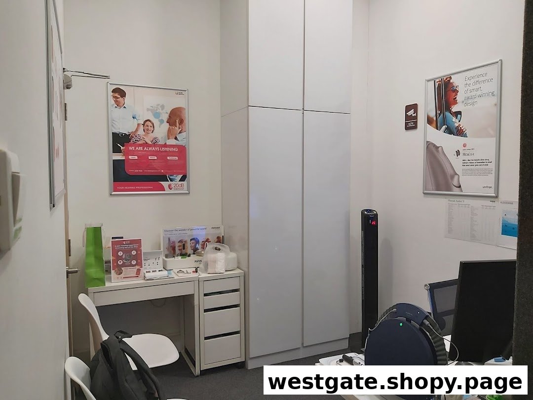 An interior view of a 20dB Digisound consultation room with posters and equipment.