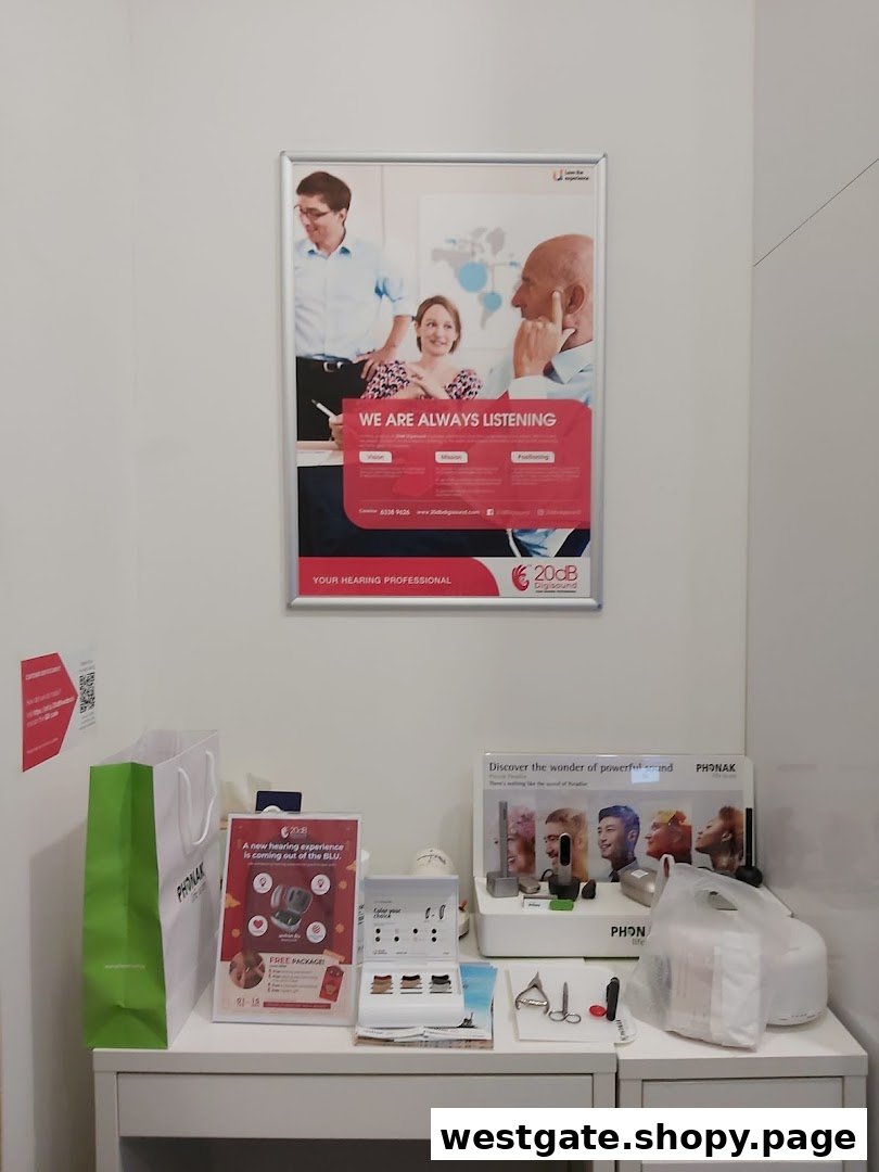 An interior shot of 20dB Digisound, featuring hearing aid displays, promotional posters, and product information.