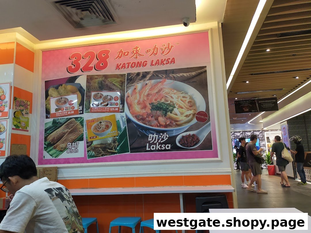 A large promotional display for 328 Katong Laksa featuring their signature dishes and Michelin recognition.
