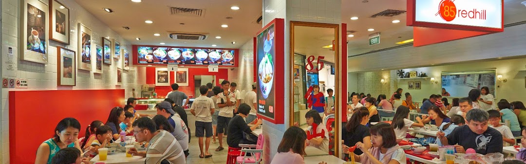 A bustling interior of 85 Redhill Teochew Fishball Noodles, with many customers enjoying their meals.