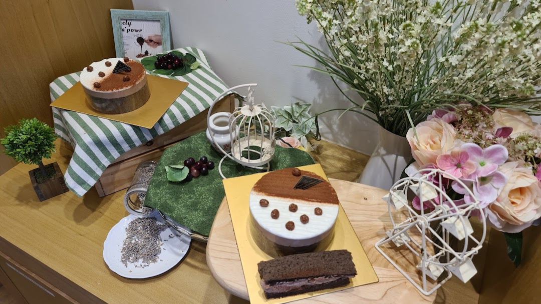 A delightful display of two cakes and a chocolate bar, showcasing baking creations.