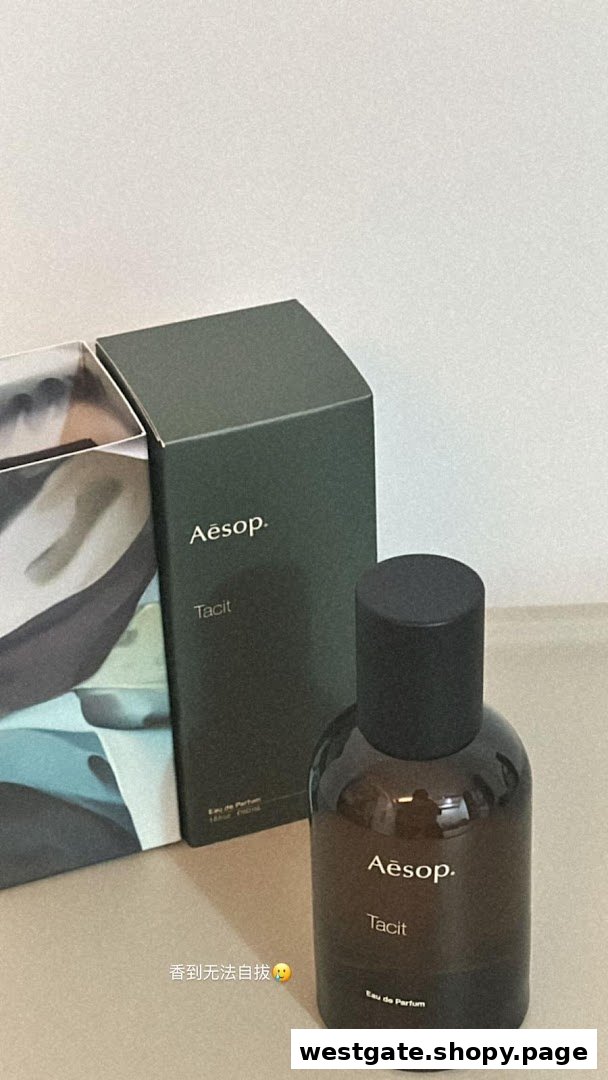 An Aesop Tacit Eau de Parfum bottle and its packaging box are displayed on a surface.