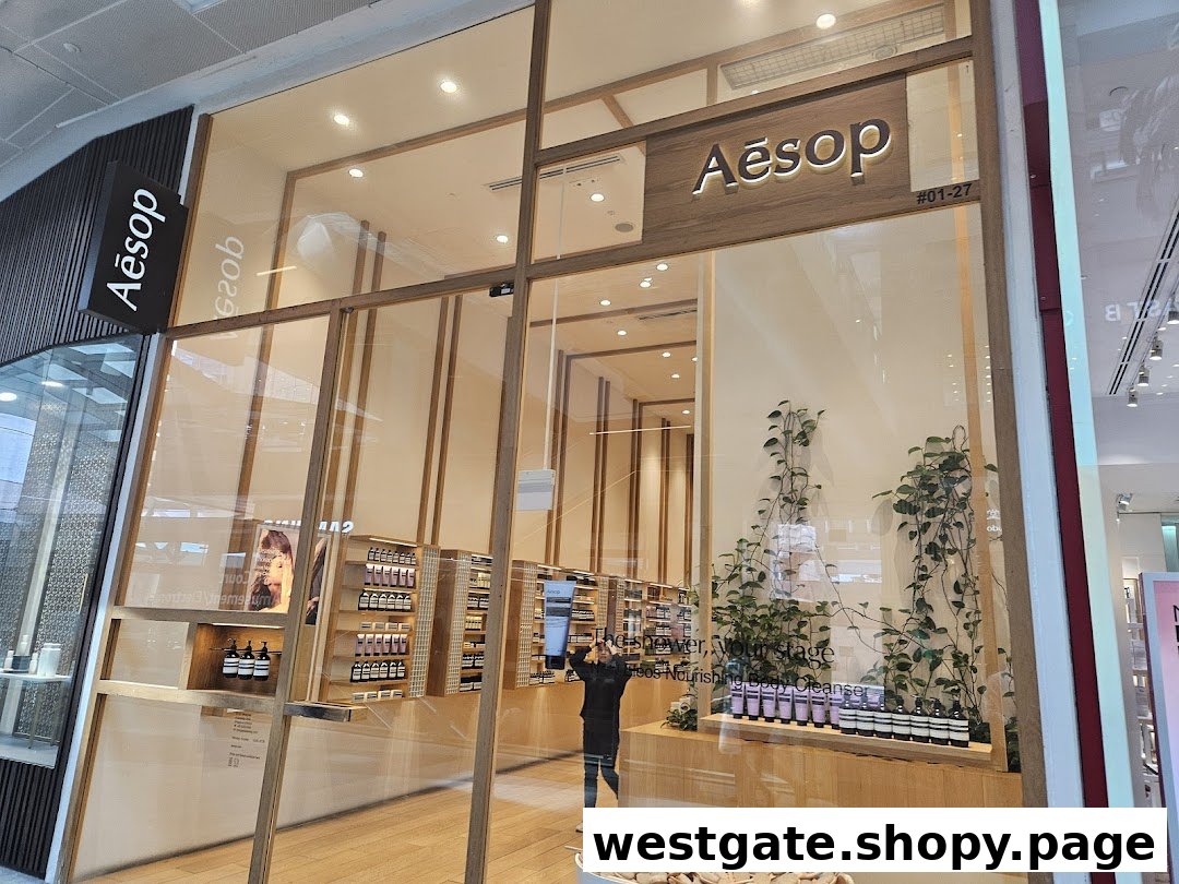 The elegant storefront of an Aesop boutique, showcasing its natural skincare and fragrance products through large glass windows.