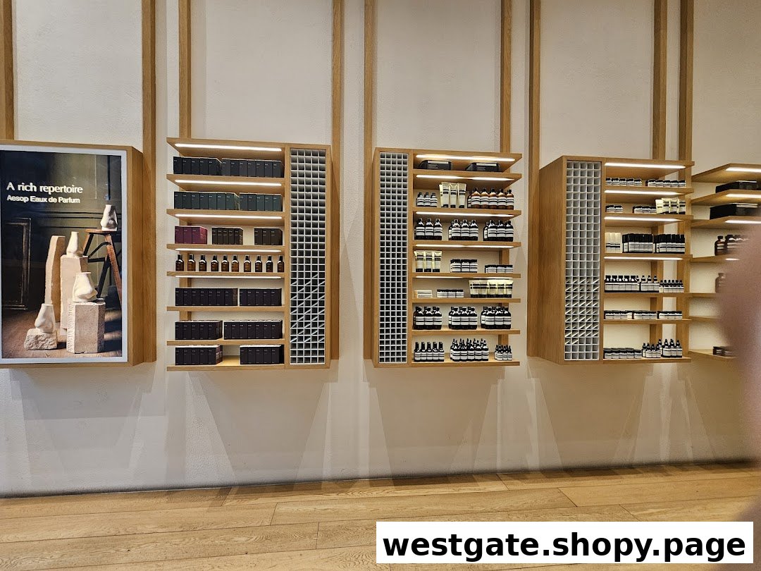 Aesop's minimalist interior features beautifully arranged skincare and fragrance products on wooden shelves.
