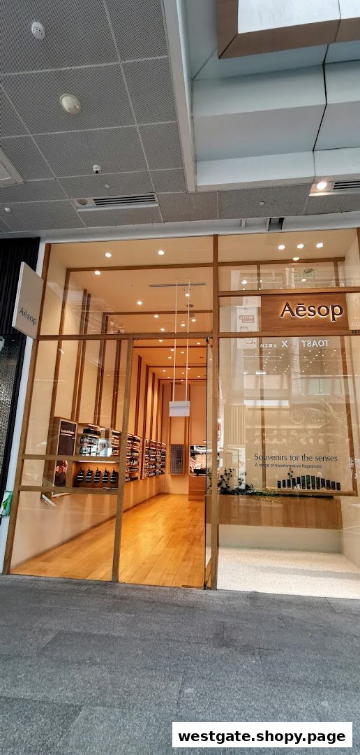 The elegant and minimalist shop front of an Aesop store, featuring wooden accents and glass windows.