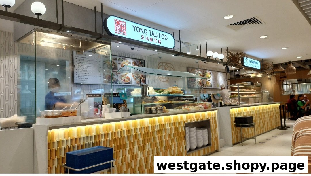A vibrant counter of Ah Chew Yong Tau Foo, showcasing fresh ingredients and a clear menu board.