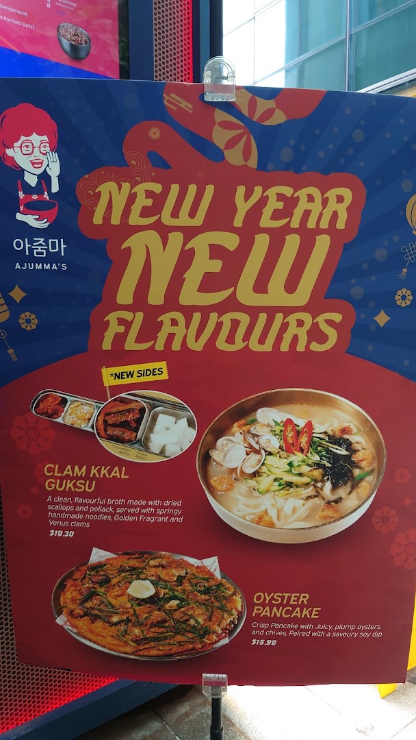 A promotional poster for Ajumma's featuring New Year special dishes and new sides.