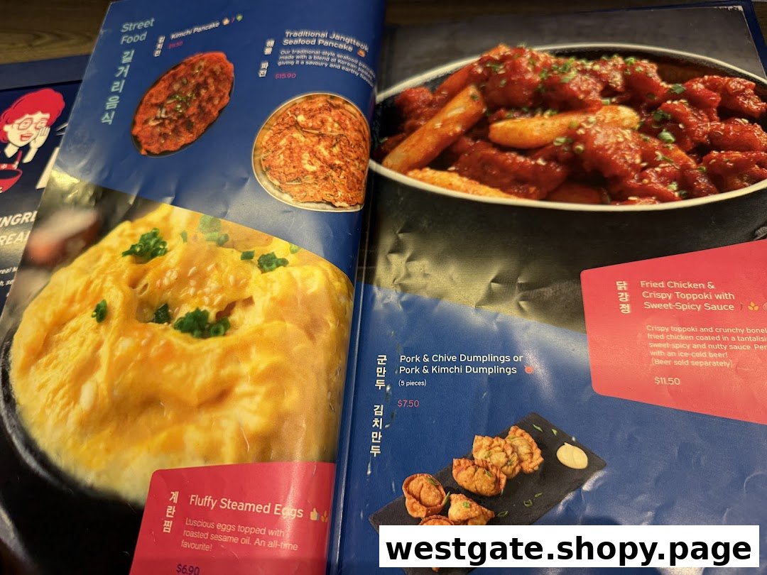 A close-up view of a Korean restaurant menu featuring various dishes like pancakes, steamed eggs, dumplings, and fried chicken.