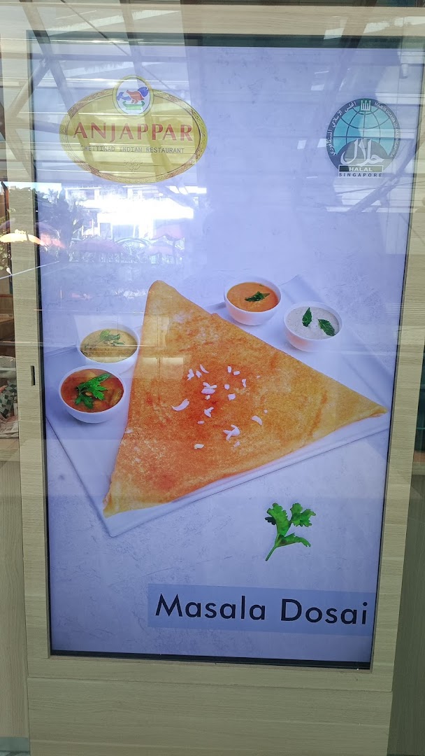 A digital display showcasing a delicious Masala Dosai with chutneys and the Anjappar restaurant logo.