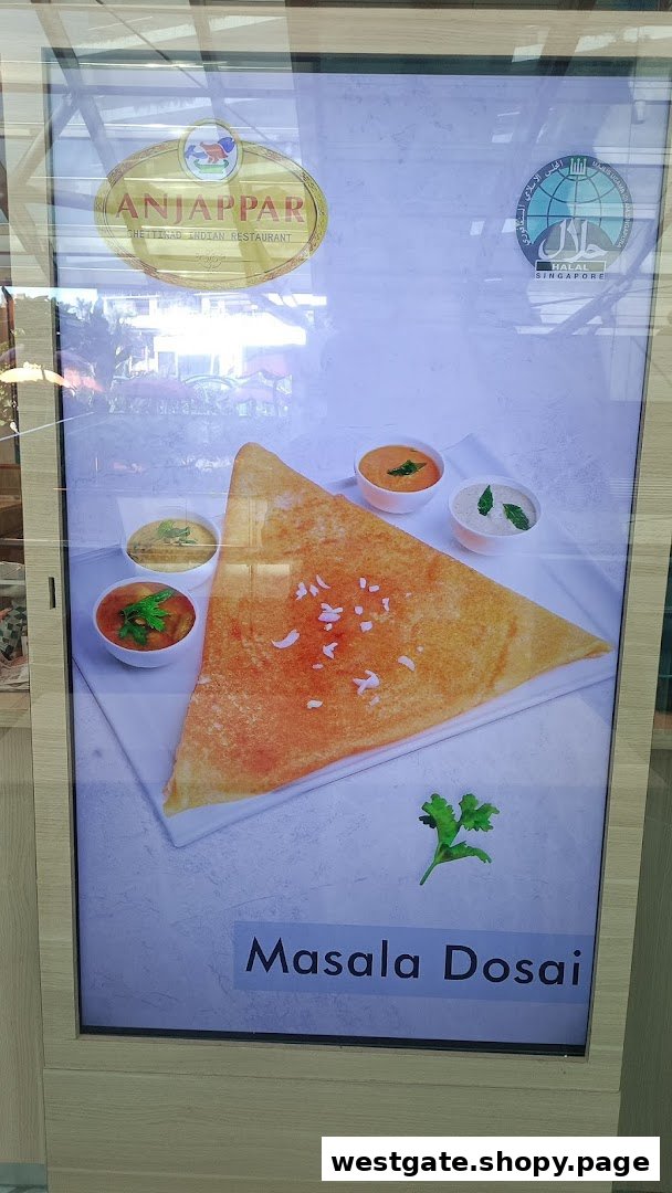 A digital display showcasing a delicious Masala Dosai with chutneys and the Anjappar restaurant logo.